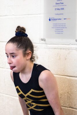 Gymnast pulling a face in a candid moment during training